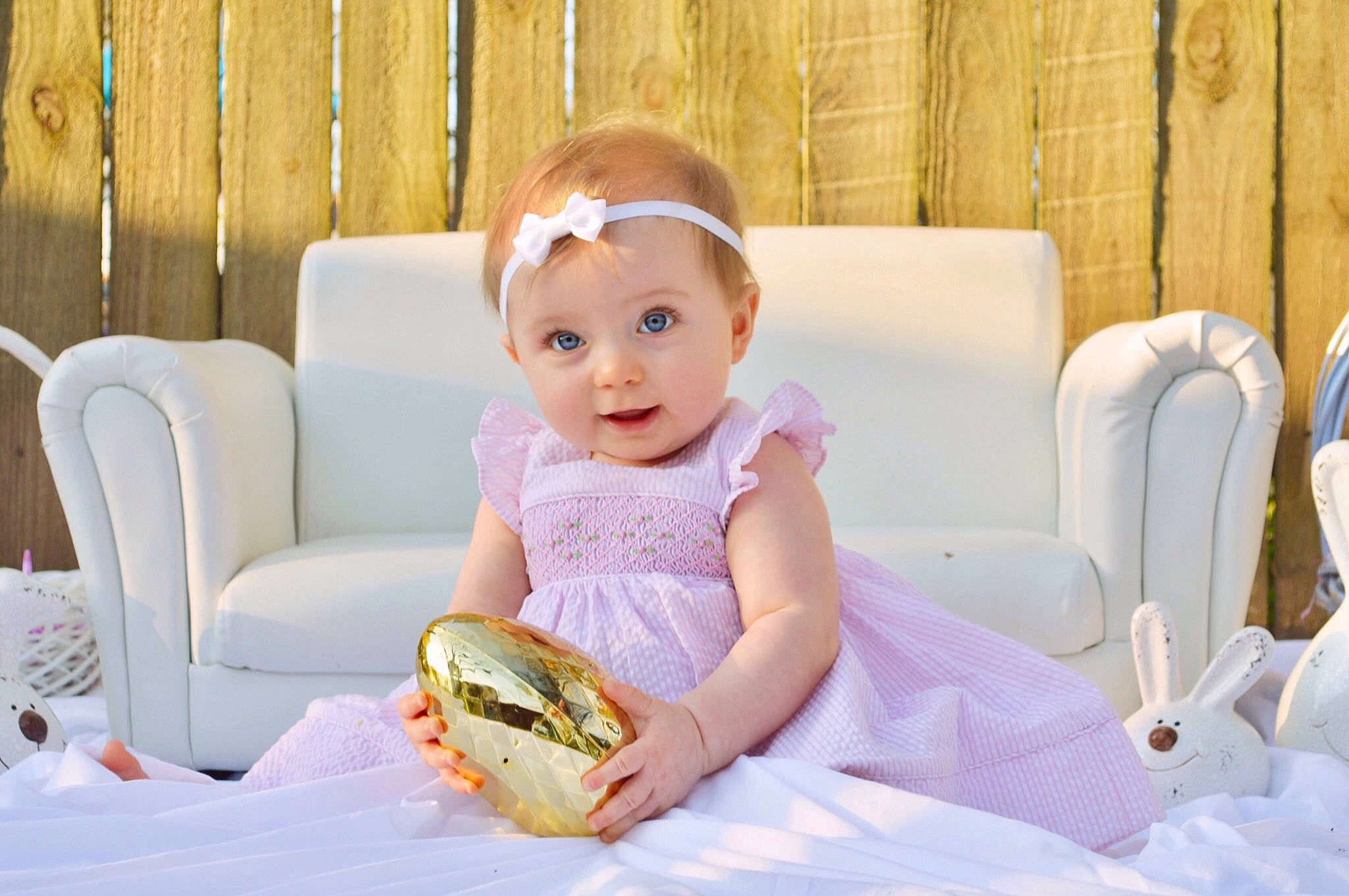 Marceline is registered to the contest to win money with this photo: arm, baby, baby_toddler_clothing, chair, child, comfort, couch, dress, event, finger_food, flash_photography, fun, happy, jewellery, person, room, sandwich, sitting, smile, summer