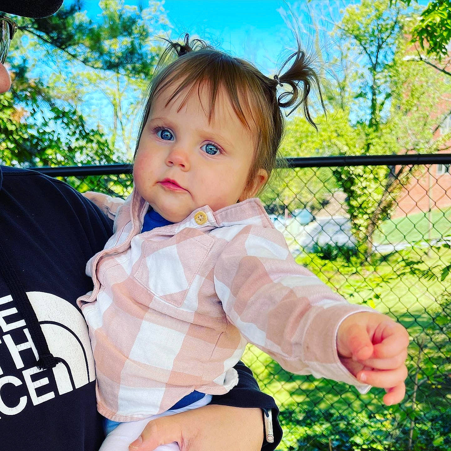 Averie is registered to the contest to win money with this photo: baby, baby_toddler_clothing, child, fence, fun, gesture, grass, happy, leisure, people_in_nature, person, plant, recreation, sitting, sky, sleeve, spring, summer, thigh, toddler