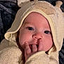 baby, child, towel, hood, giraffe, cute, face, fingers, mouth, eyes, blanket, soft, cozy, infant, person, portrait, skin, expression, sleepwear, indoors