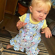 Kiersten is registered to the contest to win money with this photo: baby, bodypart, cabinet, clothing, door, dress, face, finger, footwear, furniture, hand, head, pants, person, photography, portrait, shoe, shorts, sitting, wood