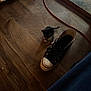 kitten, cat, shoe, sneaker, wooden_floor, floor, indoor, cord, black_and_white, pet, small, animal, feline, flooring, cable, worn, domestic, cute, tiny, standing