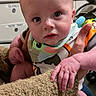 Adam joined the competition — help win amazing prizes! adult_hand, baby, background, bib, cabinet, clothing, curious, drawer, drool, expression, face, fuzzy_texture, green_eyes, hand, holding, indoor, infant, person, sleeve, sweater
