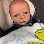 Adam joined the competition — help win amazing prizes! baby, infant, face, blanket, car_seat, denim, clothing, blue, expression, portrait, child, young, cute, person, indoor, seat, head, serious, skin, newborn