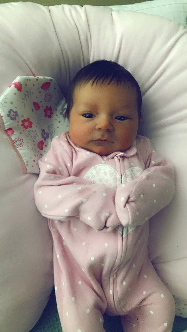 Journey is registered to the contest to win money with this photo: baby, baby_toddler_clothing, cheek, chest, comfort, drinkware, eyelash, facial_expression, gesture, hairstyle, human, lip, neck, nose, person, skin, sleeve, stomach, textile, toddler