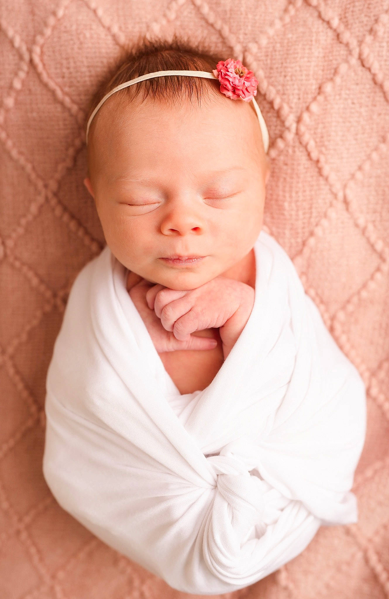 Sadie is registered to the contest to win money with this photo: baby, baby_toddler_clothing, bridal_accessory, cheek, collar, comfort, eyebrow, eyelash, face, fashion_accessory, hair_accessory, happy, head, linens, lip, peach, person, pink, sleeve, toddler