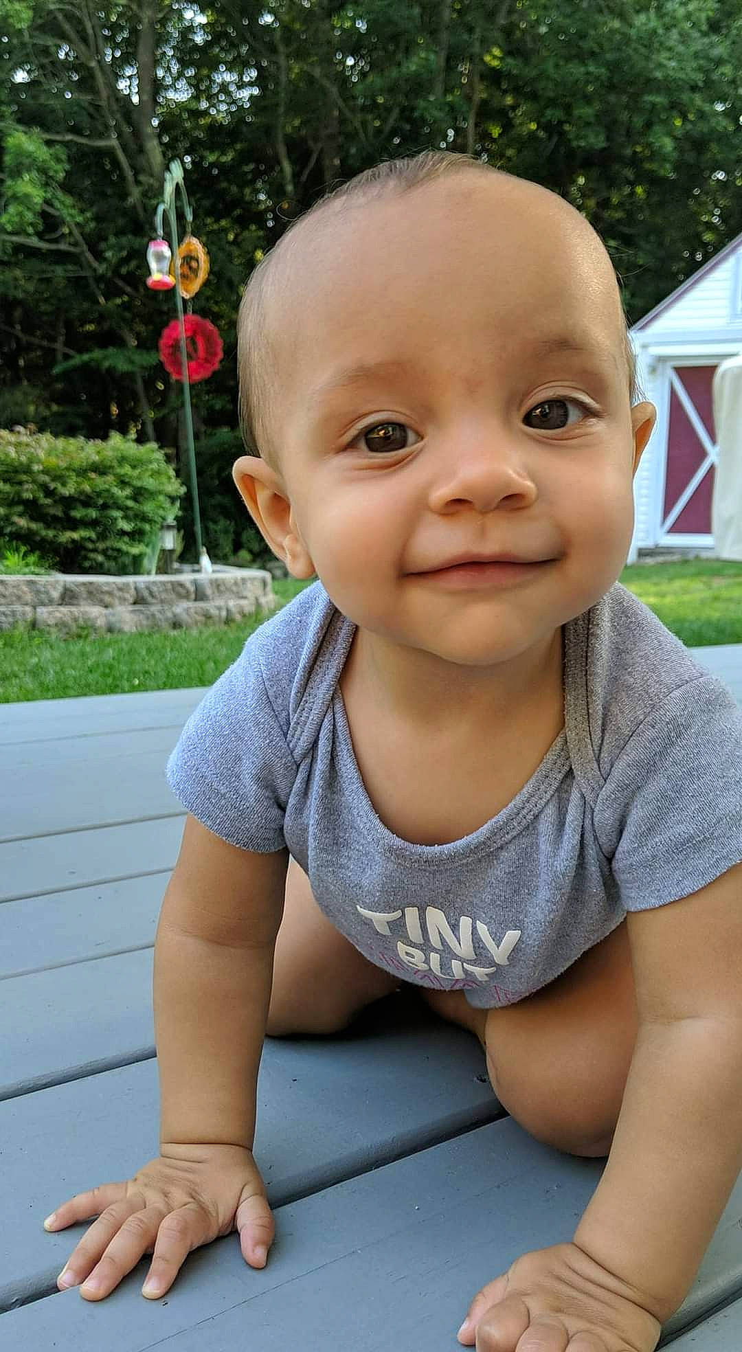 Sunnie is registered to the contest to win money with this photo: baby, child, face, facial_expression, fun, grass, happy, head, joy, laugh, lip, person, play, sitting, skin, smile, summer, toddler