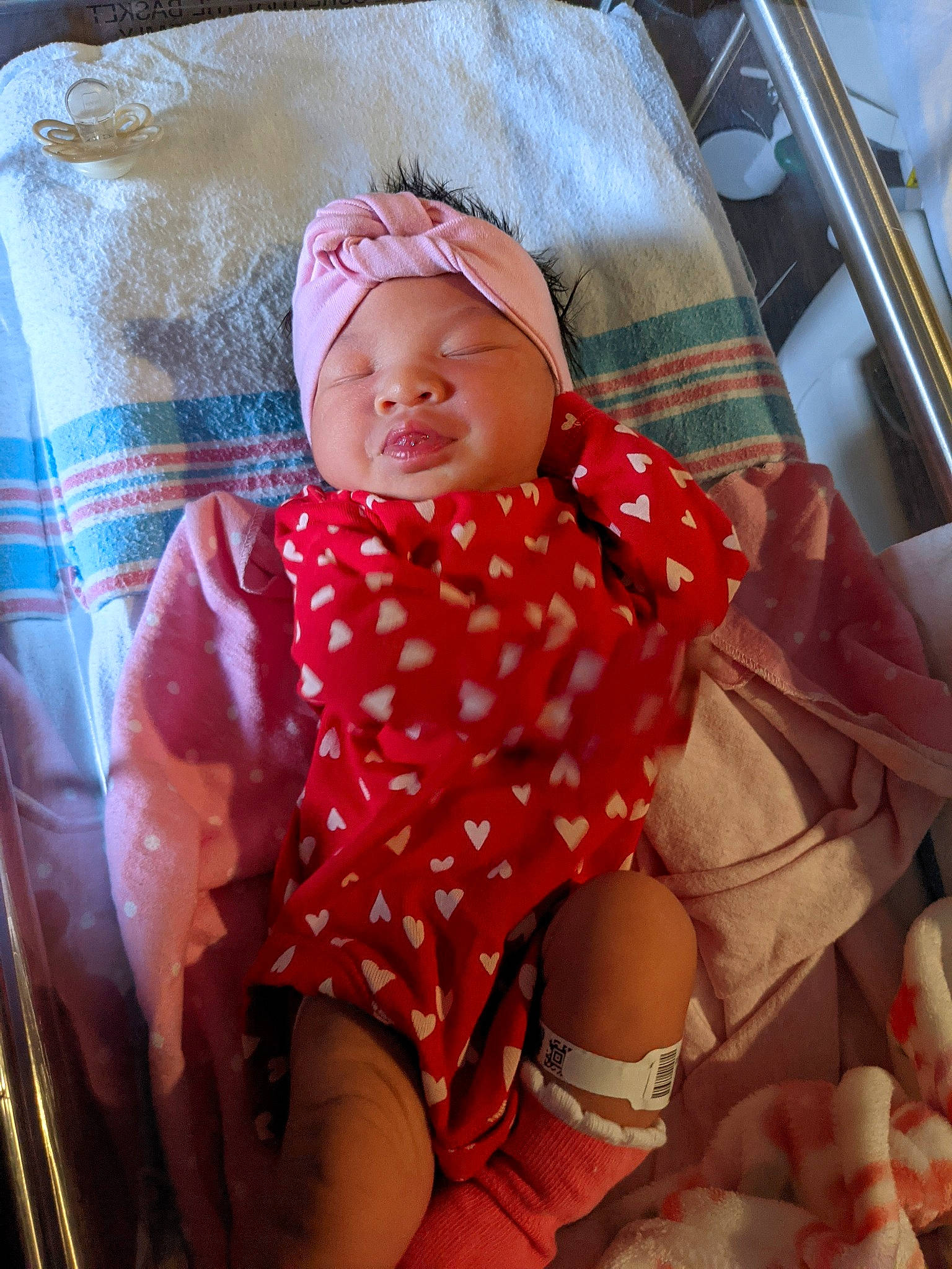 EliovÃii is registered to the contest to win money with this photo: baby, baby_safety, baby_sleeping, baby_toddler_clothing, cheek, child, comfort, eye, headwear, human_leg, linens, mouth, pattern, person, pink, shorts, skin, sleeve, textile, thigh