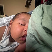 Aaliyah is registered to the contest to win money with this photo: baby, sleeping, closeup, infant, peaceful, cheeks, blanket, indoor, resting, soft, cute, child, portrait, skin, clothing, hand, head, peace, relaxation, newborn