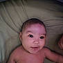 Aaliyah is registered to the contest to win money with this photo: baby, infant, face, skin, pillow, lying_down, child, cute, smile, eyes, head, arm, torso, indoors, person, newborn, young, resting, soft, expression