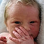 baby, newborn, closeup, hand, face, skin, blonde_hair, infant, portrait, cute, soft_light, towel, newborn_skin, small_fingers, sleepy, wrapped, child, person, baby_hand, expression