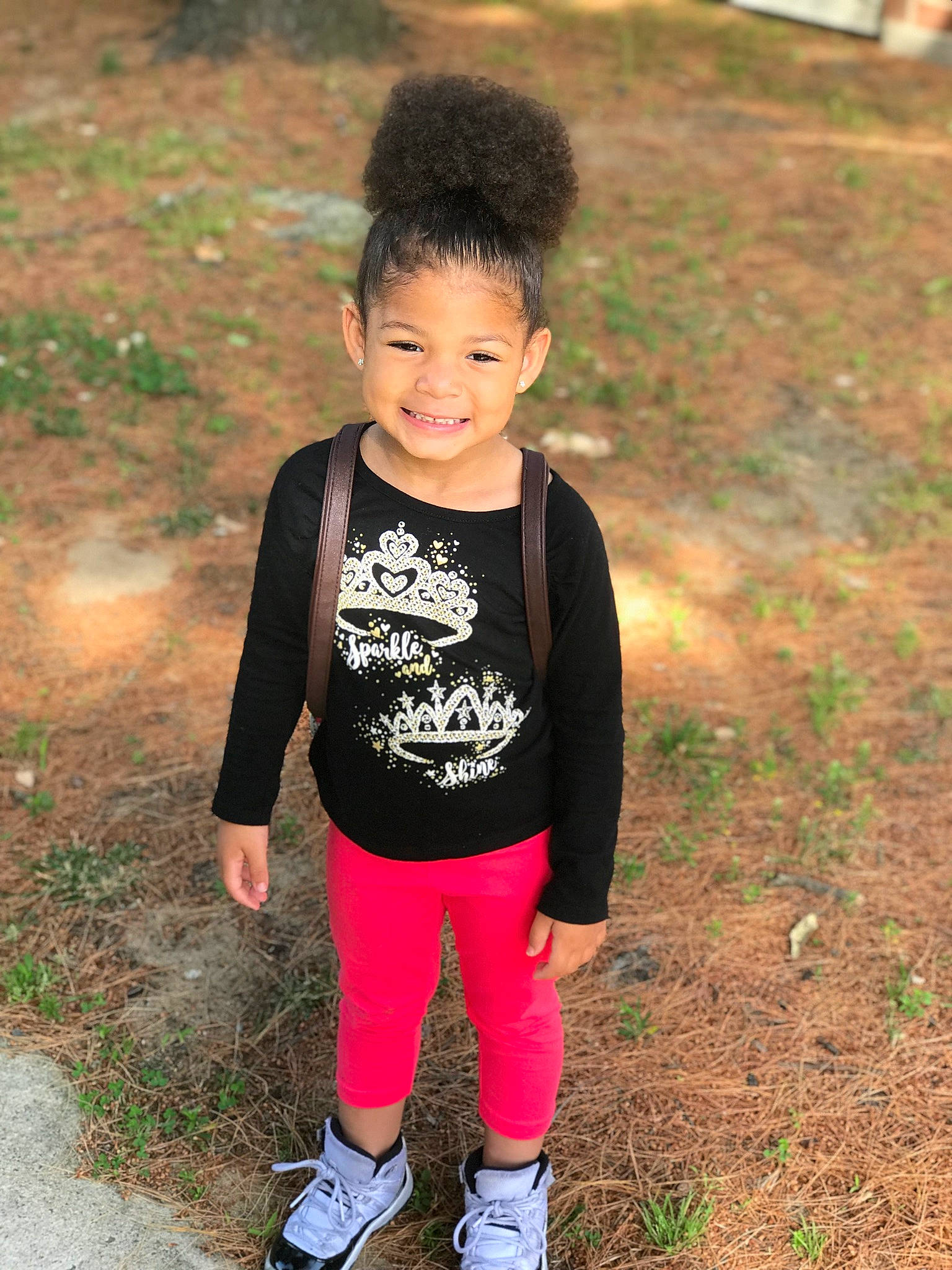 Aryanna joined the competition — help win amazing prizes! baby_toddler_clothing, child, face, grass, happy, head, joy, leggings, leisure, magenta, neck, pattern, people_in_nature, person, plant, sitting, sleeve, smile, soil, spring