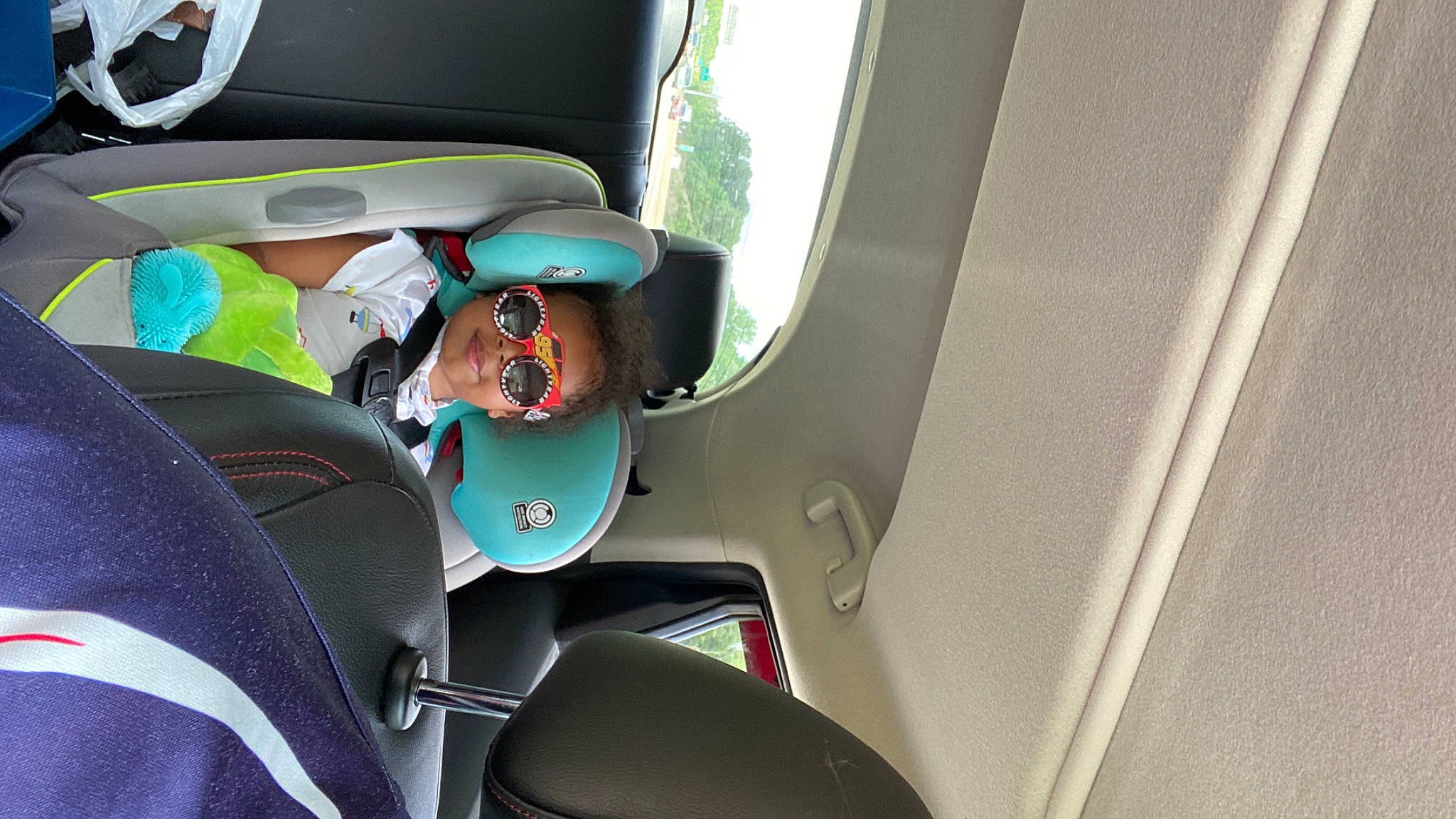 Marcus is registered to the contest to win money with this photo: aerospace_manufacturer, air_travel, auto_part, automotive_design, automotive_exterior, car, car_seat, car_seat_cover, eyewear, family_car, fixture, goggles, head_restraint, joy, luxury_vehicle, mode_of_transport, motor_vehicle, person, sunglasses, vehicle