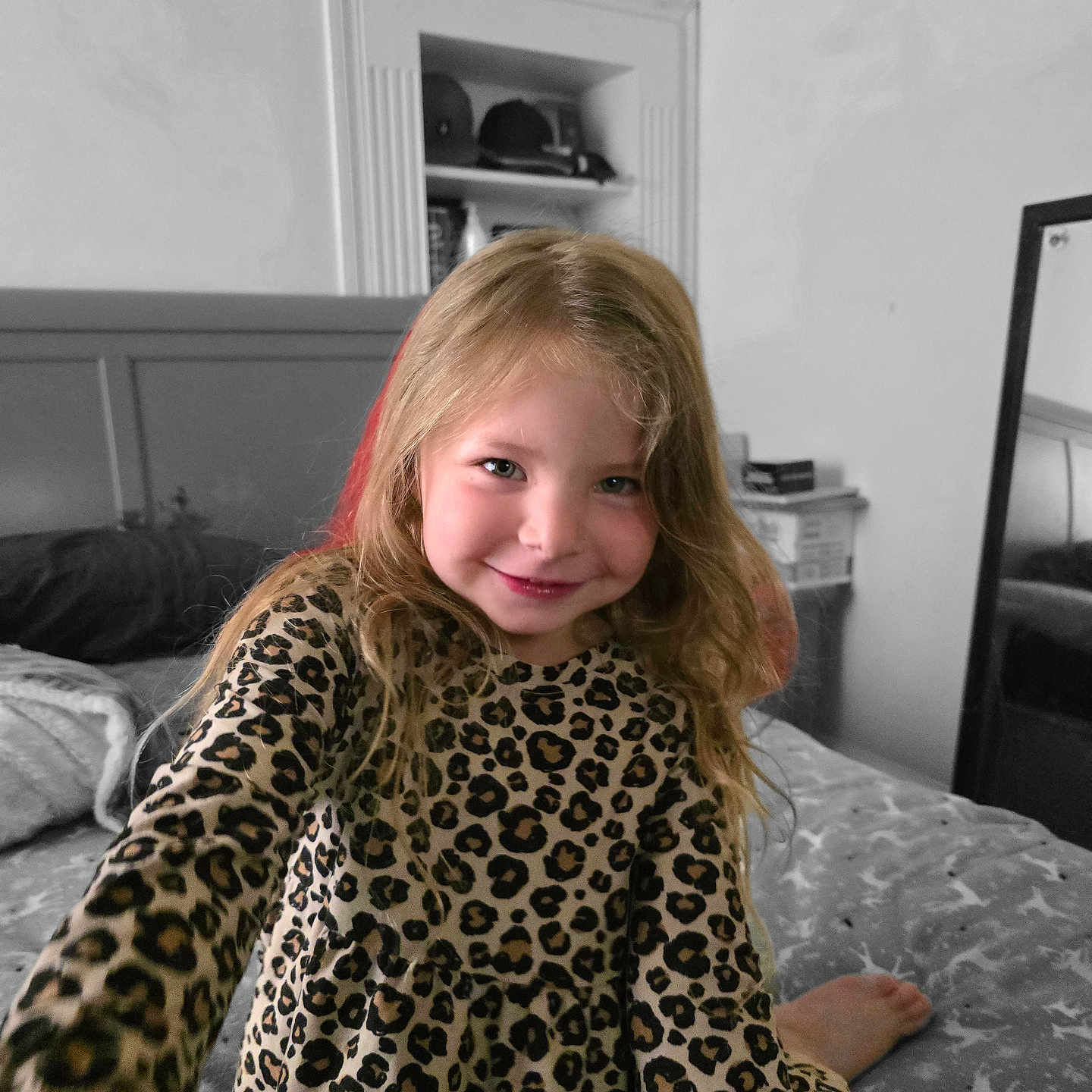 Kezli is registered to the contest to win money with this photo: bed, bedding, blonde_hair, casual, child, cute, dress, furniture, girl, happy, home, indoor, leopard_print, long_hair, mirror, portrait, room, selective_color, shelf, smiling