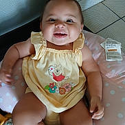 Miracle joined the competition — help win amazing prizes! baby, child, infant, smiling, yellow_outfit, winnie_the_pooh, playpen, cushions, toy, polka_dots, happy, cute, chubby_cheeks, sitting, indoors, face, person, clothing, portrait, baby_toy