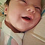 baby, smile, face, closeup, happy, infant, newborn, soft, fabric, skin, person, child, cute, joy, comfort, clothing, head, cheeks, mouth, lying_down