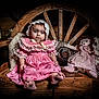 baby, bonnet, child, cute, decor, fabric, face, feet, flowers, indoor, person, pink_dress, portrait, rag_doll, sitting, soft_lighting, vintage_style, wagon_wheel, wood, wooden_bench