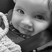 Joani joined the competition — help win amazing prizes! baby, child, smiling, black_and_white, close_up, face, eyes, blanket, car_seat, toy, beads, clothing, cute, infant, portrait, happy, seatbelt, texture, young, person