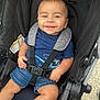 baby, child, smiling, stroller, seatbelt, blue_shirt, denim_shorts, blue_socks, infant, harness, cute, portrait, outdoor, seat, happy, young_child, baby_clothes, baby_boy, person, casual