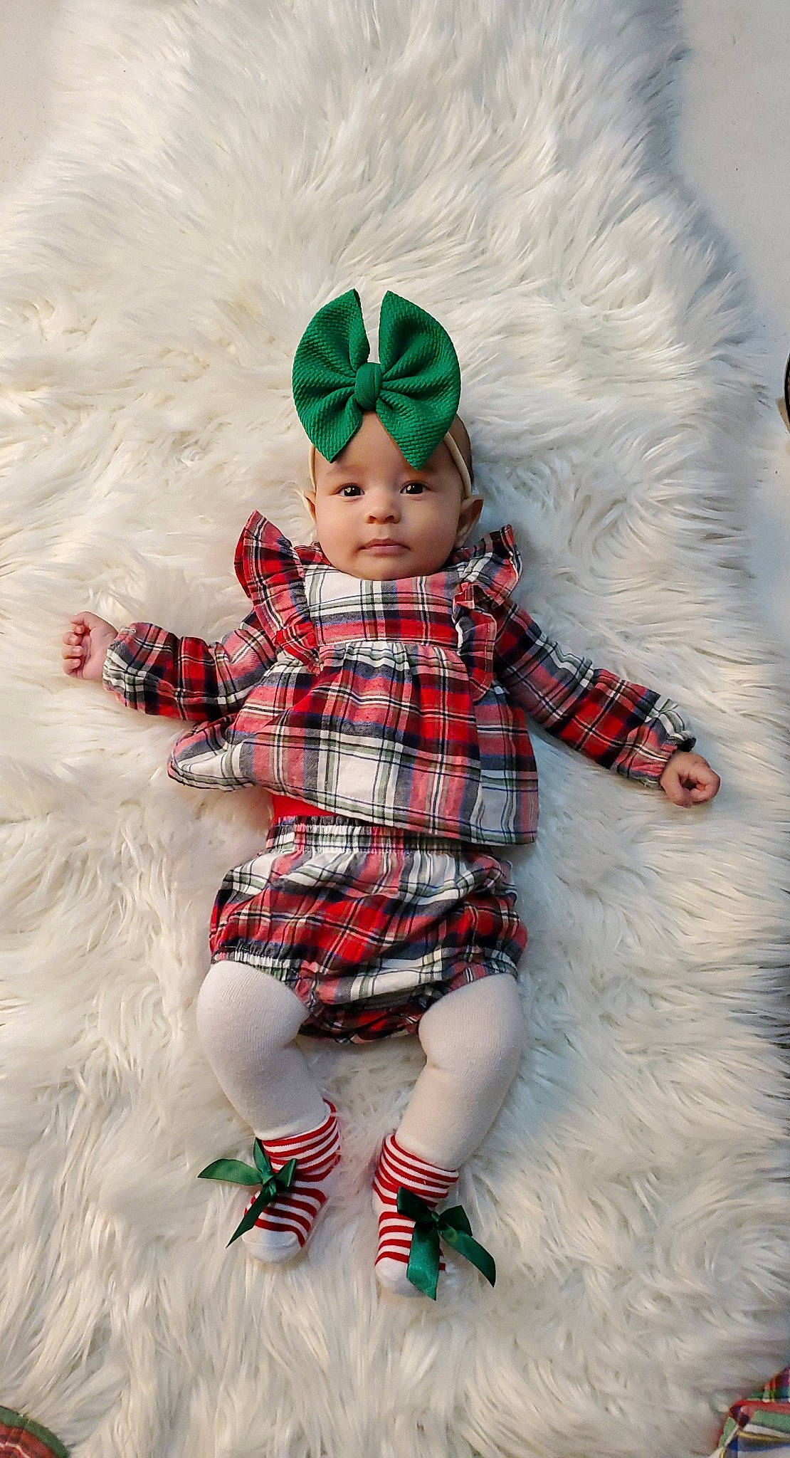 Lydia joined the competition — help win amazing prizes! baby_toddler_clothing, cap, christmas, costume_hat, design, doll, dress, fictional_character, fur, head, headgear, headwear, holiday, pattern, person, pink, plaid, sleeve, tartan, textile