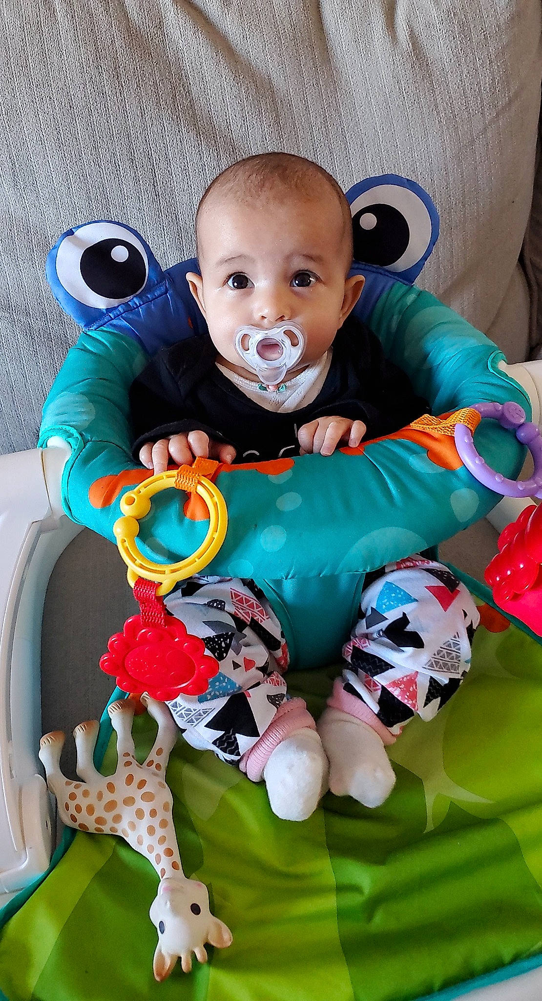 Lydia is registered to the contest to win money with this photo: baby, baby_products, baby_toddler_clothing, blue, chair, cheek, child, comfort, cool, fun, grass, green, happy, head, human_body, linens, person, pink, sitting, toddler