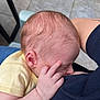 Charlie participe au concours pour gagner de l'argent avec cette photo : baby, infant, breastfeeding, hand, face, skin, yellow_clothing, person, arm, close_up, peaceful, feeding, newborn, human, tiled_floor, resting, sleeping, parent, comfort, intimate