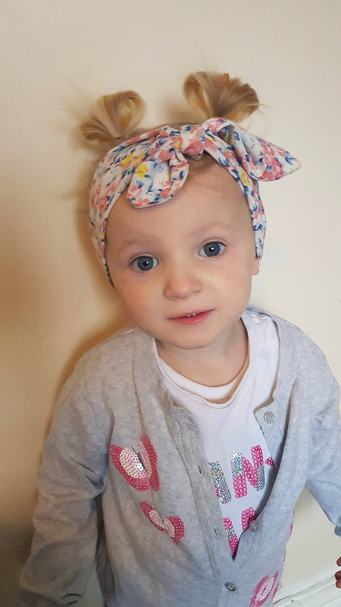 Caitlyn joined the competition — help win amazing prizes! baby, cap, cheek, child, clothing, costume_accessory, ear, fashion_accessory, fur, hair_accessory, hat, head, headgear, organ, pattern, person, pink, smile, toddler