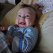 Gracie joined the competition — help win amazing prizes! baby, blanket, cheeks, child, comfort, cozy, cute, expression, fabric, face, happy, indoors, infant, lying_down, pillow, polka_dot, portrait, smiling, striped_clothing, toddler