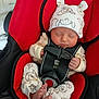 baby, infant, car_seat, red_car_seat, sleeping, hat, pajamas, animal_print, foot, toes, straps, safety_buckle, child, indoors, cute, peaceful, newborn, resting, close_up, soft_lighting