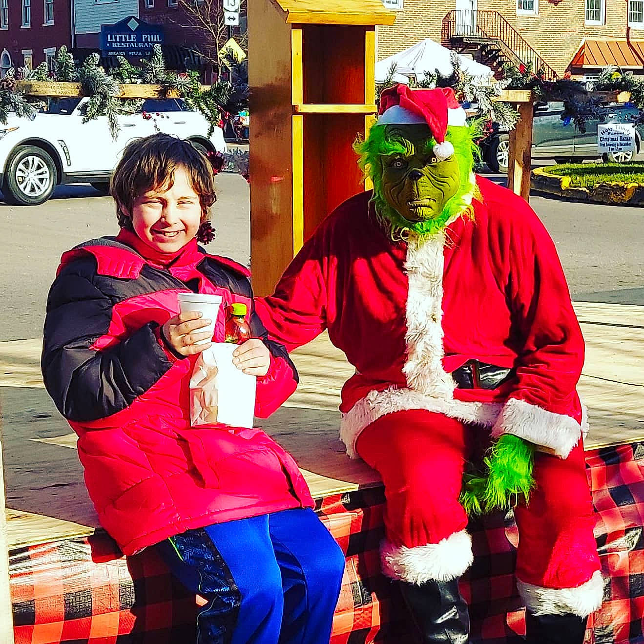 Josiah is registered to the contest to win money with this photo: car, community, cool, costume, event, fun, happy, hat, joy, leisure, magenta, person, recreation, red, santa_claus, smile, t_shirt, textile, tire, travel