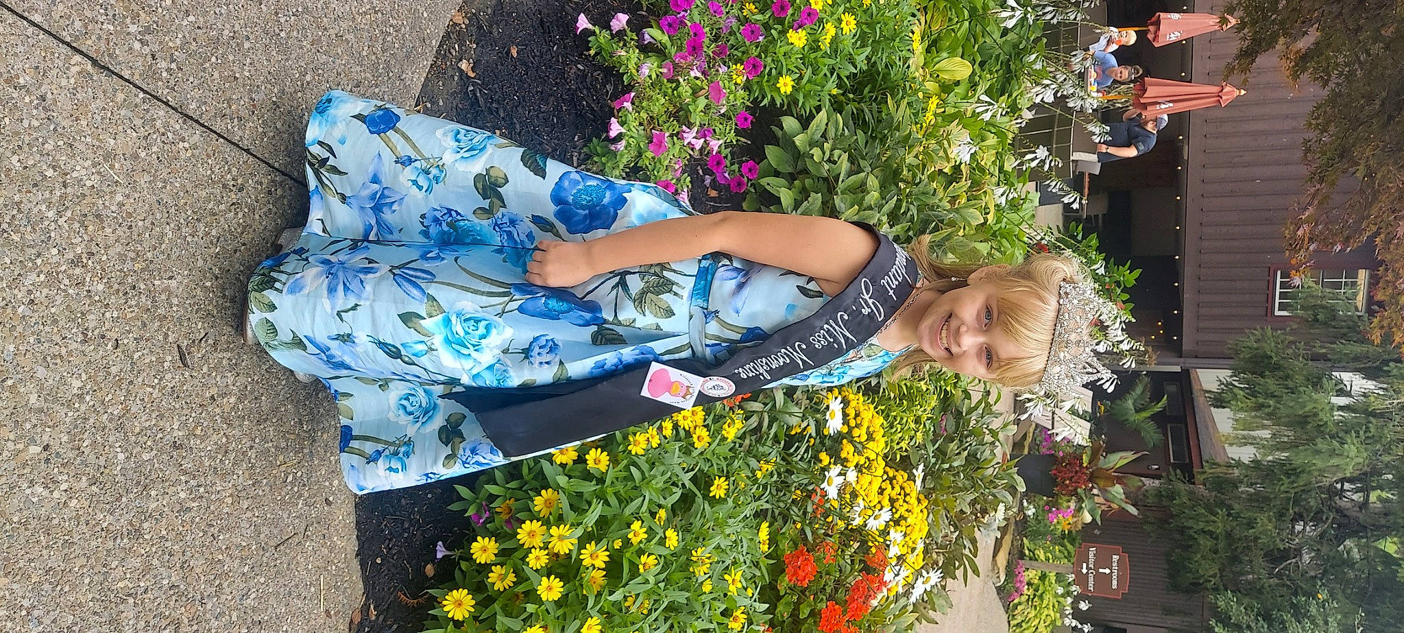 Lillian joined the competition — help win amazing prizes! annual_plant, botany, dress, electric_blue, event, floral_design, floristry, flower, flower_arranging, flowering_plant, grass, groundcover, happy, joy, leisure, people_in_nature, person, petal, plant, shrub