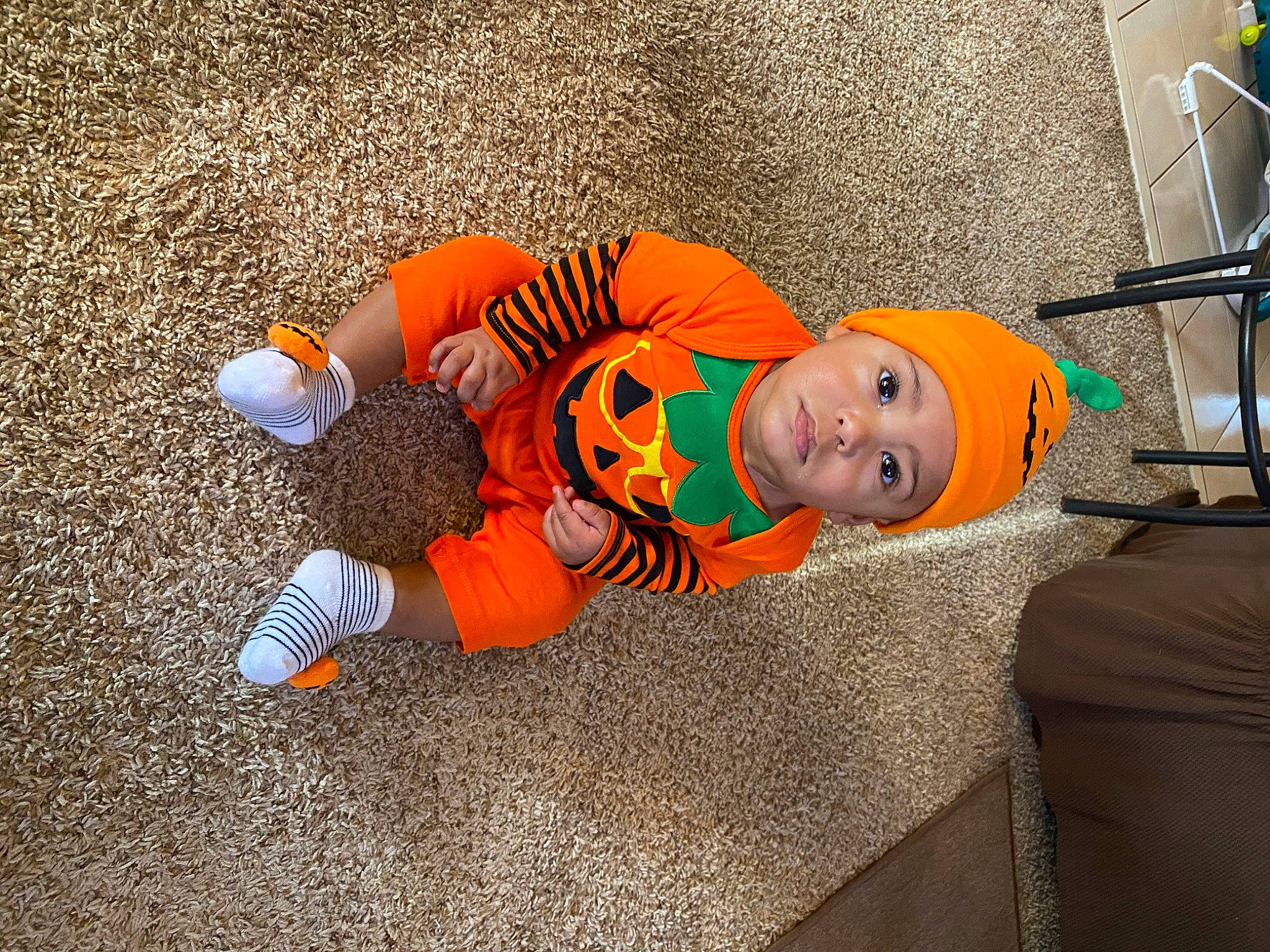 Melék is registered to the contest to win money with this photo: asphalt, baby, baby_products, baby_toddler_clothing, child, comfort, concrete, floor, flooring, fun, grass, headwear, leisure, orange, person, play, room, sidewalk, sitting, sleep