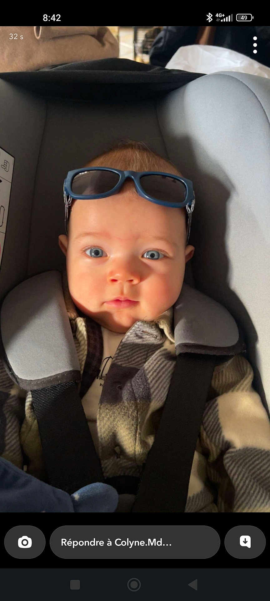 Noa a rejoint le concours — aidez-le/la à gagner de superbes lots ! baby, child, car_seat, sunglasses, blue_eyes, plaid_jacket, straps, infant, seatbelt, portrait, indoor, cute, face, headwear, clothing, young_child, baby_boy, expression, closeup, soft_light
