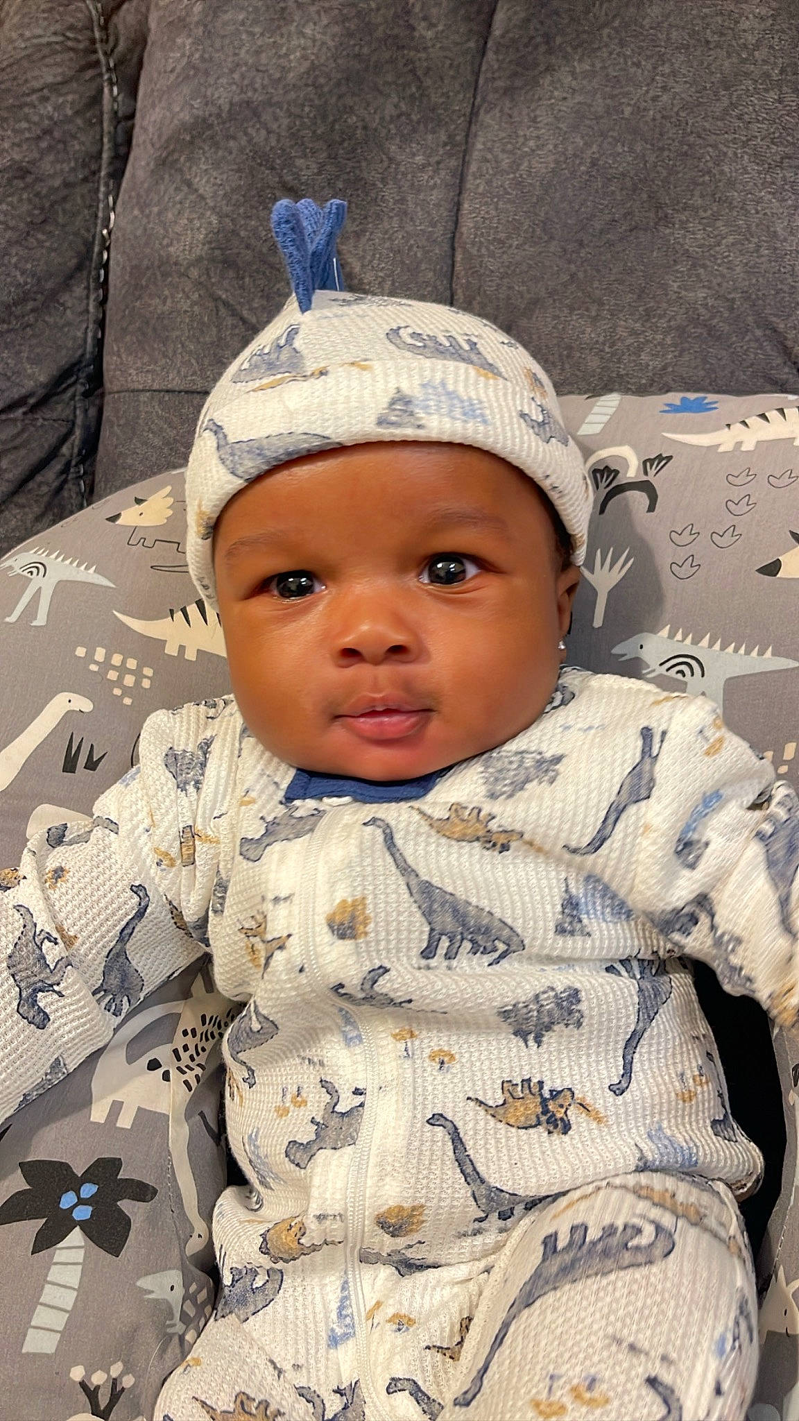 Kartiér is registered to the contest to win money with this photo: baby, baby_toddler_clothing, cap, cheek, child, fashion_accessory, fun, happy, headwear, linens, military_camouflage, pattern, person, portrait_photography, sitting, skin, sleeve, smile, toddler, uniform