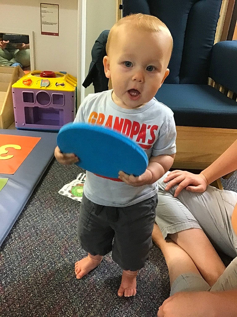 Maximus joined the competition — help win amazing prizes! baby_toddler_clothing, barefoot, child, comfort, flooring, foot, fun, happy, human_leg, joint, knee, lap, leg, leisure, person, room, sitting, surprise, t_shirt, thigh