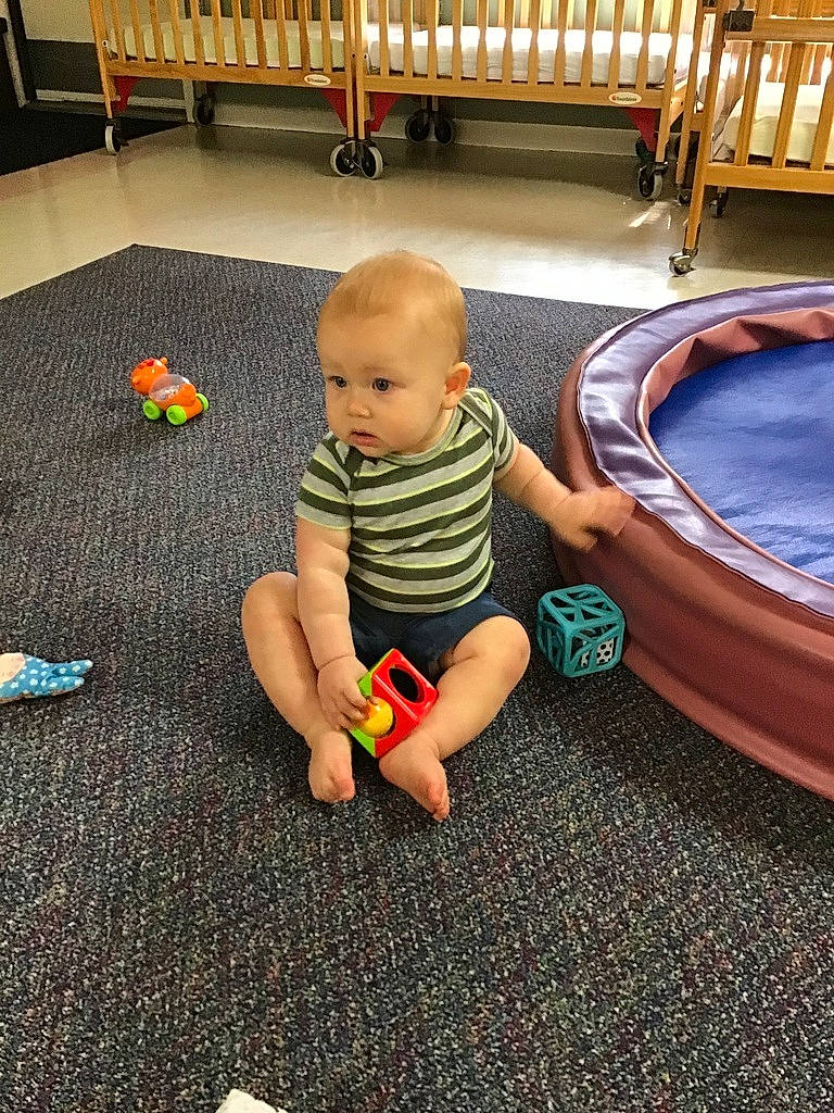 Maximus joined the competition — help win amazing prizes! baby, baby_products, baby_toddler_clothing, carpet, child, comfort, crawling, floor, flooring, fun, grass, hardwood, human_leg, leisure, person, play, room, sitting, toddler, toy