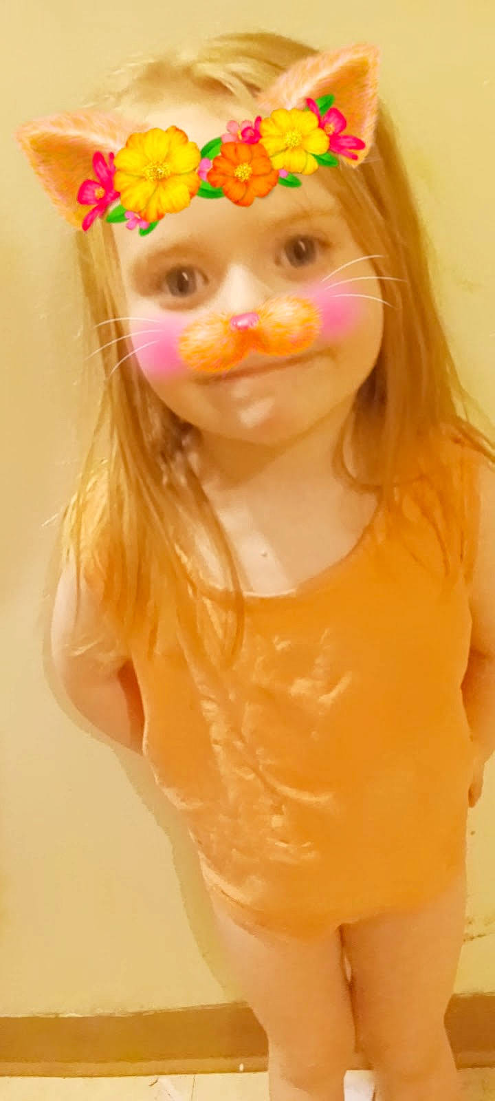 Mia is registered to the contest to win money with this photo: cap, chin, ear, eyebrow, eyelash, eyewear, fawn, hair, hairstyle, head, headwear, iris, lip, long_hair, neck, nose, orange, person, pink, sleeve