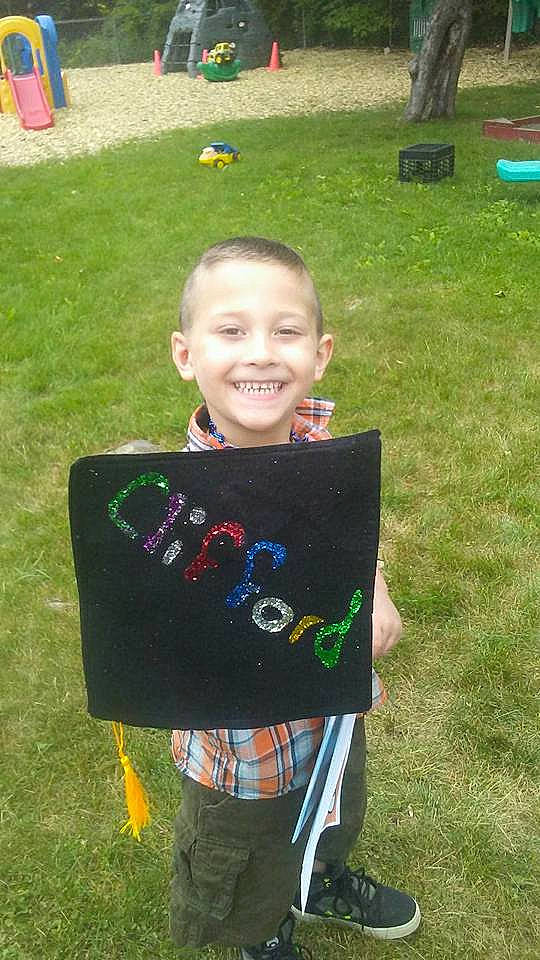 Clifford is registered to the contest to win money with this photo: child, grass, joy, person, play, smile