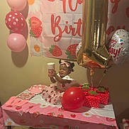 Shania joined the competition — help win amazing prizes! toddler, child, birthday, party, balloons, table, gift_boxes, pink, red, dress, bow, strawberry, banner, cups, napkins, plates, celebration, happy, indoor, smiling