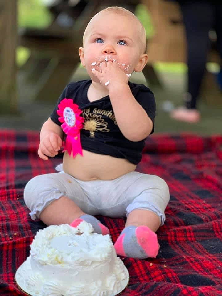 Baelynn joined the competition — help win amazing prizes! baby, baby_toddler_clothing, child, event, flooring, fun, grass, happy, human_leg, knee, lap, pattern, person, pink, plaid, recreation, sitting, sock, tartan, thigh