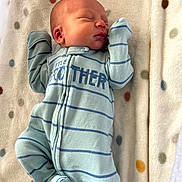 Nathaniel joined the competition — help win amazing prizes! newborn, baby, sleeping, onesie, blue, striped_clothing, blanket, polka_dot, infant, child, soft_texture, cute, peaceful, portrait, lying_down, indoors, clothing, small_hands, small_feet, face