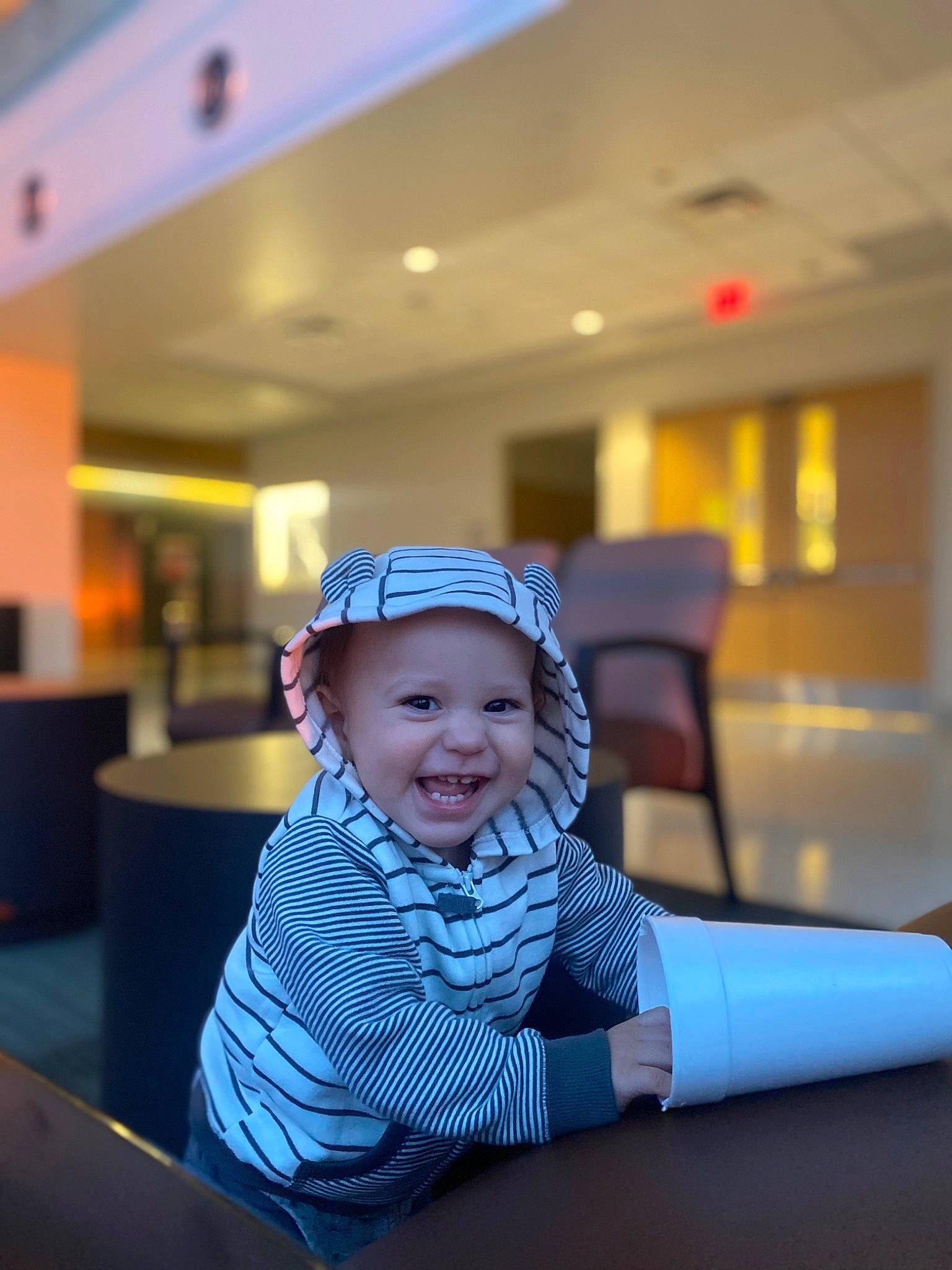 Isaias is registered to the contest to win money with this photo: baby, baby_toddler_clothing, cap, electric_blue, event, fashion_accessory, flash_photography, flooring, fun, happy, hat, headgear, headwear, helmet, leisure, person, personal_protective_equipment, recreation, room, sleeve