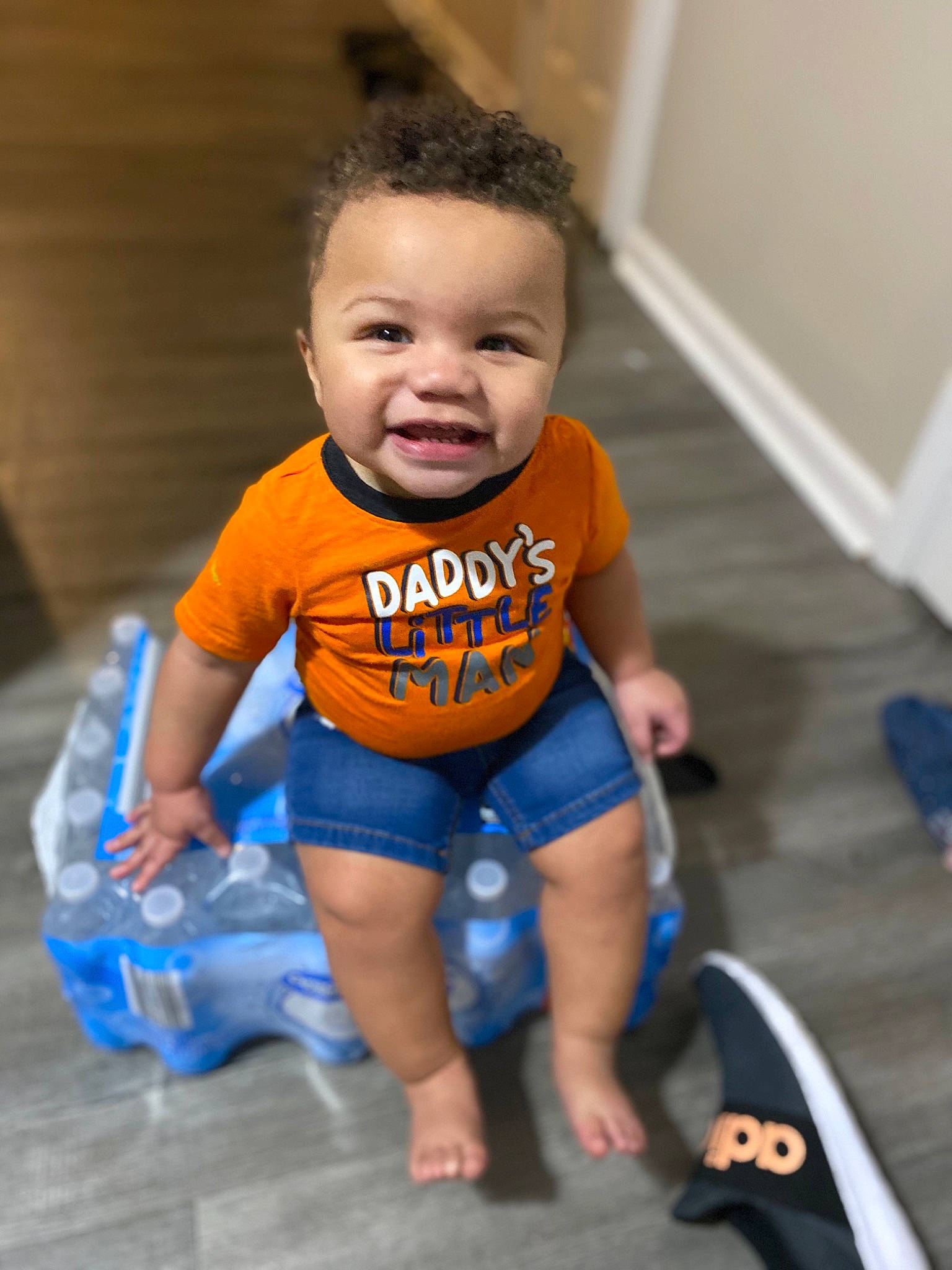 Jermaine joined the competition — help win amazing prizes! arm, baby, baby_products, baby_toddler_clothing, blue, child, floor, fun, leg, person, play, product, sitting, skin, smile, standing, toddler
