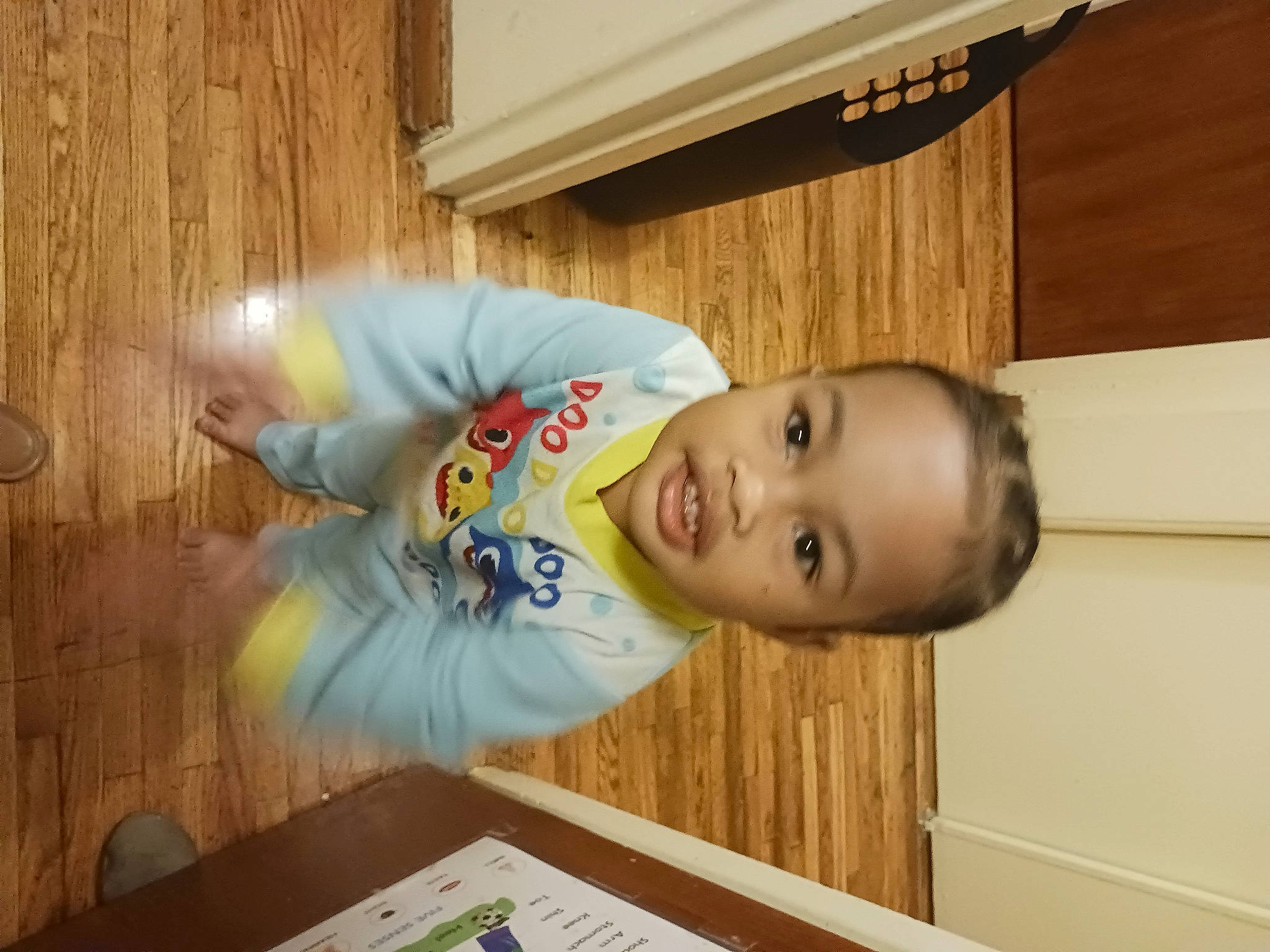 Clementine joined the competition — help win amazing prizes! baby, baby_laughing, baby_toddler_clothing, child, flooring, fun, happy, hardwood, person, room, smile, t_shirt, toddler, varnish, wood, wood_stain