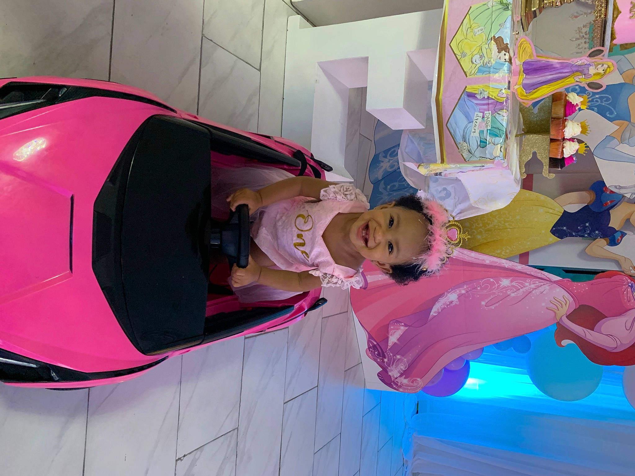 Ka Miyah joined the competition — help win amazing prizes! automotive_design, automotive_exterior, automotive_lighting, baby, bumper, car, fun, hood, house, joy, magenta, motor_vehicle, person, pink, product, recreation, smile, toddler, trunk, vehicle