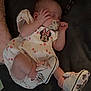 baby, sleeping, pacifier, infant, dress, minnie_mouse, shoes, pink, white, cute, child, resting, indoors, soft_surface, footwear, person, small_hand, closed_eyes, clothing, cozy
