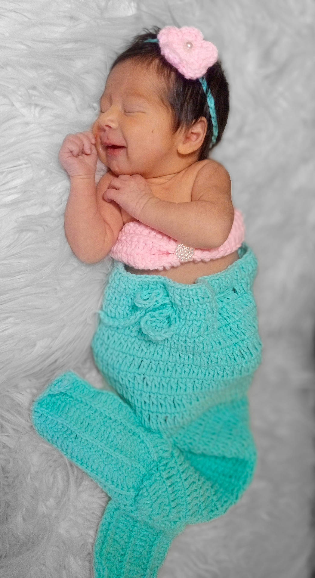 Maizey is registered to the contest to win money with this photo: accessories, baby, blanket, bodypart, cap, clothing, face, finger, glove, hand, happy, hat, head, knitwear, newborn, person, photography, portrait, smile, sweater