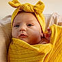 Kaislee joined the competition — help win amazing prizes! baby, infant, portrait, yellow_blanket, headband, bow, close_up, wrapped, soft_texture, cute, child, newborn, indoors, expression, face, skin, eyes, hand, warm, cozy