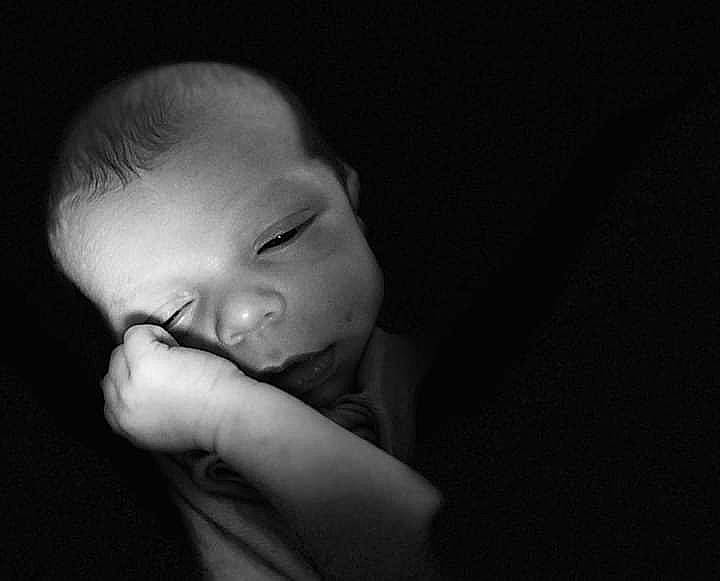 River is registered to the contest to win money with this photo: baby, baby_toddler_clothing, cheek, child, chin, comfort, darkness, ear, eye, eyebrow, flash_photography, gesture, hair, happy, iris, lip, monochrome, monochrome_photography, nose, person