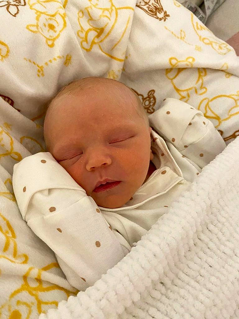 Lillie is registered to the contest to win money with this photo: baby, baby_sleeping, baby_toddler_clothing, bedding, bedtime, child, comfort, happy, linens, nap, pattern, person, portrait_photography, skin, sleep, textile, toddler, white