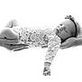 baby, newborn, infant, sleeping, lace_clothing, headband, hands, tattoos, black_and_white, portrait, peaceful, close_up, soft_light, studio, candid, human, cute, delicate, child, resting